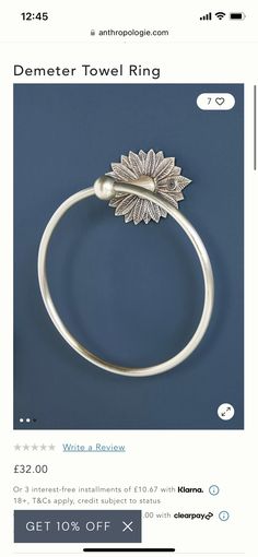 an image of a towel ring with a flower on the front and back of it