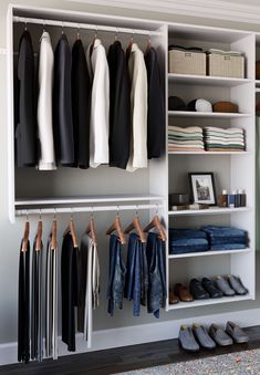 an organized closet with clothes and shoes