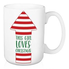 this girl loves christmas coffee mug with red and green stripes on the bottom, which reads'this girl loves christmas '