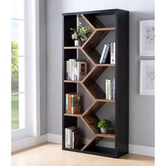 a bookshelf with several shelves in the corner