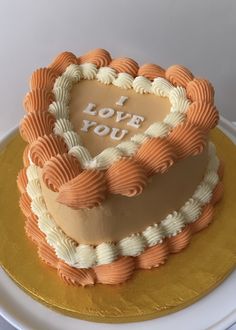 a heart shaped cake with the words i love you on it