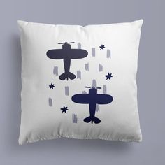 a pillow with an airplane and stars on it