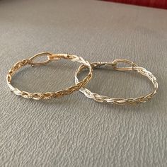 These bracelets are braided using a standard three-strand pattern, just like you would use when braiding hair or rope. The large hook and eye closure is part of the entire design, and allow the wearer to hook and unhook the bracelet with one hand; no helper should be needed! I have two variants: silver with a twisted gold wire as an accent and gold with a twisted silver wire. I make them in a range of sizes (in 1/4 inch increments) to fit any wrist. Yes! Sizes!! To determine the size you need, m Blacksmith Jewelry, Diy Wire Jewelry Rings, Wire Jewelry Rings, Hook Bracelet, Diy Wire Jewelry, Braided Bracelet, Jewellery Ideas, Braiding Hair, Jewelry Wire