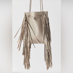 Uo X Silence And Noise Dolly Fringe Cross Body Bag In Ivory Nwt Omg This Bag Is So Cute! Super Soft Leather With Swinging Fringe Studded Tassels. Drawstring Closure. Big Enough For Just Your Essentials And Cute Enough For Everyday! I Love This Bag. Ivory Is An Off White Sorta Cream Color. I Included A Photo Of The Black Version With The Model So You Can Get A Better Feel For Size. Measurements In Photos. New With Tags. Urban Outfitters Bags, Urban Outfitters Bag, Small Sling Bag, Floral Balloons, Leather Fringe Bag, Wooden Prints, Hooded Flannel, Padded Headband, Red Leopard