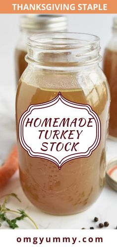 a jar filled with homemade turkey stock sitting on top of a table