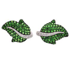 Elegant leaf shaped clip-on earrings. They have a foldable post so they can be worn both on pierced ears or not. They are set with 5.56 carats of brilliant cut vivid green tsavorites and 0.63 carat of white diamonds. French Hallmark Green Garnet Jewelry, Tsavorite Jewelry, Earrings Multiple, Earrings Leaf, Jewelry Real, Jewellery Diamond, Green Garnet, Earrings Clip, Earrings Diamond