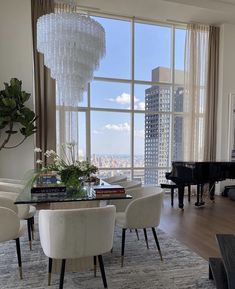 a living room filled with furniture and a piano