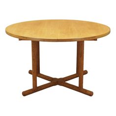 a round wooden table with two crossed legs on an isolated white background for display or montage