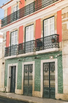 an old building with balconies and wrought iron railings