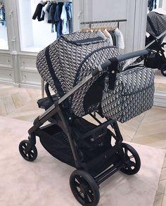 a baby stroller sitting on top of a rug