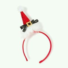 a red and white headband with a santa hat on it's top,