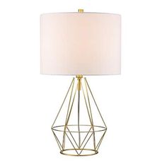 a table lamp with a white shade on the base and a gold metal cage design