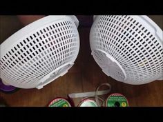 two air purifiers sitting on top of a wooden floor next to each other