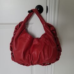 Elie Tahari Leather Hobo Handbag Ruffle Design Around Bag Satin Lining Gold Tone Hardware 8" Drop Strap Approx And Hanging From The Shoulder One Interior Zipper Pocket And Two Slip Pockets Size 11.518.5" Approx And Taken From The Middle Part. It's Hard To Measure Because Of Its Irregular Shape Excellent Worn Condition. There Are No Visible Scratches That I Can See On The Exterior. The Only Flaws I Can See Are Two Pen Marks On The Upper Part Of The Strap, As Shown On The Last Pics And 2 Pen Marks On The Bottom Part Of The Strap. Light Wear On The Clasp And One Small Stain On The Interior Lining Of The Bag. No Dust Bag Leather Hobo Handbags, Satin Bags, Elie Tahari, Middle Parts, Hobo Handbags, Leather Hobo, Zipper Pocket, Dust Bag, Bag Lady