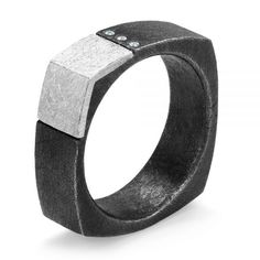 107126 Platinum and Oxidized Sterling Silver Ring   3 Diamonds - .03 ctw. This stylish men’s ring is a modern take on the classic square band designs. The blend of oxidized sterling silver with the platinum inlay celebrates art and craftsmanship. Whether you choose to hold on to this ring or gift it to someone special, you won’t go wrong.       Contrasting Metals with Diamond Accents      The white tones of the platinum contrast with the dark hues of the black, embellishing the corner from the s Modern Rectangular Diamond Ring, Modern Rectangular Diamond Ring With Single Cut Diamonds, Modern Jewelry With Single Cut Rectangular Diamonds, Modern Rectangular Jewelry With Single Cut Diamonds, Modern Oxidized Finish Rings For Anniversary, Modern Oxidized Finish Anniversary Ring, Layered Rings, Glam And Glitter, Swirl Ring