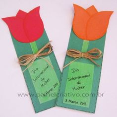 two orange and red flowers on green tags