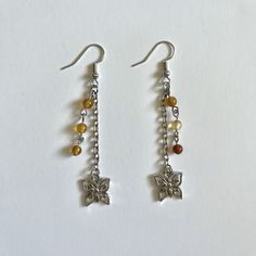 -glass brown/clear beads -silver butterfly charm -lightweight -dangly/stacked design  -fishhook earring Brown Beaded Earrings, Butterfly Chandeliers, Brown Butterfly, Diy Butterfly, Brown Earrings, Clear Beads, Phone Charms, Fish Hook Earrings, Silver Butterfly