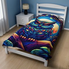 a bed with an owl design on it