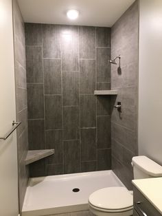 a bathroom with a toilet, shower and bathtub in it's stall area