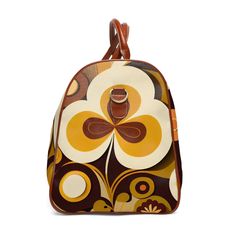 Jet set in retro style with this 60s-70s inspired geometric duffel bag. Featuring bold abstract floral prints in mod colors, this groovy weekender carry-on pops with psychedelic flower power. The durable construction and leather accents make this 20" × 12'' × 9" bag ideal for road trips or overnight getaways. With its vibrant old school vibe, this hip weekend bag turns heads while keeping your essentials organized. Travel back to the age of peace and free love with this funky modular duffel! One Retro Multicolor Bags With Zipper Closure, Retro Travel Bag With Zipper Closure, Retro Yellow Satchel Bag, Retro Rectangular Bag With Zipper Closure, Retro Brown Bags With Zipper Closure, Vintage Multicolor Bag With Zipper Closure, Retro Rectangular Duffle Bag For Everyday Use, Brown Travel Bags, Retro Yellow Travel Bag