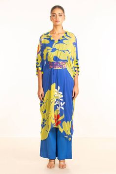 Blue kaftan with all-over contrast floral patterns, with embroidered highlights. Comes with blue pant and floral embroidered belt.
Components: 3
Type Of Work: Floral
Neckline: V Neck
Sleeve Type: Batwing
Fabric: Kaftan- Chiffon, Pant- Mulmul
Color: Blue
Other Details: 
Tie-up belt
Occasion: Destination Wedding - Aza Fashions Blue Kaftan, V Neck Pattern, Embroidered Belt, Chiffon Floral, Floral Chiffon, Blue Pants, Pant Set, Neck Pattern, Floral Patterns