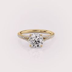 The epitome of classic elegance, this 2 carat round cut lab diamond engagement ring is a timeless treasure. The sparkling center stone, crafted from ethically sourced lab-grown diamonds, exudes brilliance and fire from every facet. Delicate side round cut diamonds add a touch of extra sparkle and create a luxurious setting. Crafted in warm 14k yellow gold, this ring complements all skin tones and offers a touch of vintage charm. It’s the perfect symbol of everlasting love for the woman who appreciates tradition with a touch of modern brilliance.  ✤𝐂𝐞𝐧𝐭𝐞𝐫 𝐃𝐢𝐚𝐦𝐨𝐧𝐝 𝐃𝐞𝐭𝐚𝐢𝐥𝐬 Color: F Clarity: VS1 Shape: Round Cut Carat Weight: 2CT Approx. Type: Lab Grown Diamond (CVD/HPHT) ✤ Ring 𝐒𝐢𝐝𝐞 𝐃𝐢𝐚𝐦𝐨𝐧𝐝 𝐃𝐞𝐭𝐚𝐢𝐥𝐬 Color: F Clarity: VS1 Shape: Round cut Carat Weight: 0.30 Gift Girlfriend, Lab Diamond Engagement Ring, Yellow Gold Engagement Rings, 2 Carat, Timeless Treasures, Classic Elegance, Lab Diamonds, Round Cut Diamond, Touch Of Modern