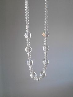 More beaded necklaces : https://www.etsy.com/shop/PlexisArt?ref=seller-platform-mcnav§ion_id=22155194 Wonderful vintage style necklace suitable for any occasion. Multifaceted crystal clear glass beads in two sizes, 20mm and 10mm. Finished with a silver tone clasp withe strass. A super example of a vintage necklace in original authentic condition. All of my necklaces is handmade with love and full attention to detail. The materials I use, are made from a small local traditional company. They use Clear Crystal Beaded Necklaces With Faceted Beads, Elegant Handmade Clear Crystal Necklaces, Adjustable Clear Necklace, Clear Crystal Necklaces With Faceted Beads, Clear Faceted Crystal Necklace With Round Beads, Faceted Clear Crystal Necklaces With Round Beads, Faceted Clear Crystal Necklace With Round Beads, Vintage Clear Crystal Necklace, Vintage Clear Glass Necklace