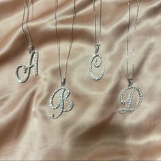 Silver Initial Necklaces With Rhinestones. Has A Lobster Clasp For Adjustment. Also Available In Gold For Certain Letters Only. Approx Length: 22 S Necklace Initial, Denver Trip, Silver Initial Necklace, Initial Necklace Silver, A Initial, Gold Lariat Necklace, Initial Necklaces, Sports Jewelry, Sterling Silver Heart Pendant