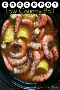 the crock pot is filled with shrimp and corn