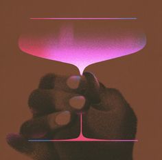 a person holding a wine glass in front of a pink and blue light that is shining