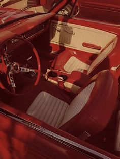 the interior of an old car is red and white