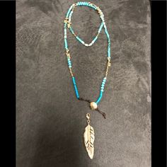 Turquoise Beads, Semi-Matte Gold Plating, Detachable Feather Charm Included. Double It Up With The Charm Or Wear It Long Without The Charm. Never Worn Blue Beaded Lariat Necklace, Adjustable Beaded Chain Long Necklace For Beach, Adjustable Beaded Long Necklace For Beach, Blue Beaded Chain Lariat Necklace, Turquoise Lariat Beaded Necklaces, Adjustable Blue Lariat Necklace, Adjustable Beaded Long Turquoise Necklace, Adjustable Blue Lariat Necklace For Festivals, Blue Adjustable Lariat Necklace