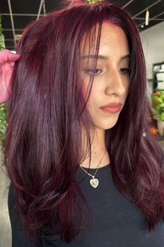 Looking to spice up your hair game? Dark red hair is the perfect way to add a bold and sultry touch to your look. 💋 #darkredhair #hairinspo #boldbeauty #sultryvibes #hairgoals #redhot 🔥 Whether you opt for a deep burgundy or a fiery auburn, this color is sure to turn heads and make a statement. 💁‍♀️ #statementhair #hairtransformation Don't be afraid to go dark and embrace your inner vixen with dark red hair. 💄 #vixenvibes #haircolor #confidenceboost #beauty #hairtrends Ashy Burgandy Hair, Wine Red And Purple Hair, Burgundy Hair With Brown, Burgundy Magenta Hair, Bellami Mulberry Wine Hair, Cool Tone Burgundy Hair, Burgundy Hair With Lowlights, Mohagni Hair Color, Hair Color Ideas Fair Skin