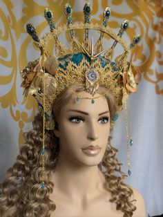 This Headdress is a beautiful statement piece that is sure to get everyone's attention. In shades of teal and gold. Goes on like a headband and ties at the base of the neck for support and adjustability. Make sure to tie it firm so that it doesn't fall off when leaning forward. It is a little heavy, but comfortable. Goddess Headdress, Fantasy Goddess, Shades Of Teal, Teal And Gold, Costume Hats, Headdress, Costume Accessories, Headpiece, Shades