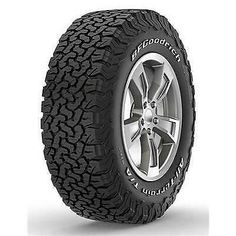 an all terrain tire on a white background