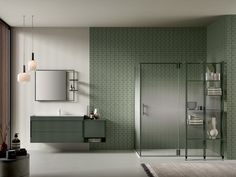 a modern bathroom with green tile walls and flooring, including a walk in shower