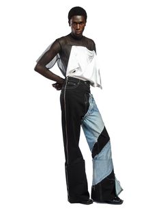 Fruché's jeans are aptly named Spiral, thanks to the contrasting denim wrapped around one leg. Crafted from soft cotton in Lagos, they sit high on the waist and fall to a generous flared leg with deep turn-ups. The 5-pocket construction is a classic silhouette, so you know they offer a comfortable fit. Style yours with the Dazed Shirt to channel the label's boundary-pushing aesthetic.- 5 pockets, side zip, wide leg- Cotton- Artisanally crafted by female communities in the Delta State- Each piece Cutout Pants, African Luxury, Osei Duro, Fashion Designer Studio, Hair Cuffs, Red Carpet Ready, Lagos Nigeria, Upcycled Denim, Dresses Pants