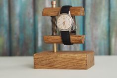 Custom Oak watch stand. Color - natural, finished with natural oils. This wooden stand is suitable for any watch. Made out of solid oak piece. Dimensions: Base: 110mm / 70mm / 30mm Height: 130mm Other materials used - brass, copper, steel spring See more of our watches: https://www.etsy.com/shop/RetroWatchMZLtd Watch Display Stand, Watch Organizer, Simple Lifestyle, Watch Stand, Tape Dispenser, Simpler Lifestyle, Jewelry Display Stands, Watch Display, Small Projects