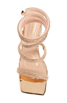 A sinuous strap coils around the ankle in this statement sandal made party-ready via an array of sparkling crystals. 3 1/2" heel Wraparound ankle strap Synthetic upper, lining and sole Imported Asian & Pacific Islander Owned/Founded Glamorous Rose Gold Party Sandals, Glamorous Rose Gold Evening Sandals, Statement Sandals, Pacific Islander, Azalea Wang, Ankle Wrap Sandals, Ankle Wrap, Sparkling Crystal, Coils