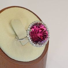 Beautiful red tourmaline 18k gold vintage ring! The gemstone is cut in the Portuguese style and the setting is made in white gold and adorned with small white diamonds. Ring Size: 6Total Weight: 10.32 gramsPrecious Metal: 18k white goldPrecious stones:-Red Tourmaline Center Stone: 25 carats, 15.8mmx14.7mm (14.2mm thick)-White Round Diamonds: 0.57 carats, QTY: 32Hallmark: 18k Red Cabochon Rings Fine Jewelry, Red Octagon Fine Jewelry Ring, Luxury Victorian Ruby Cabochon Ring, Luxury Red Cabochon Ruby Ring, Pink Tourmaline Cabochon Ring, Red Tourmaline, Platinum Diamond Rings, Etsy Gold Ring, Platinum Ring