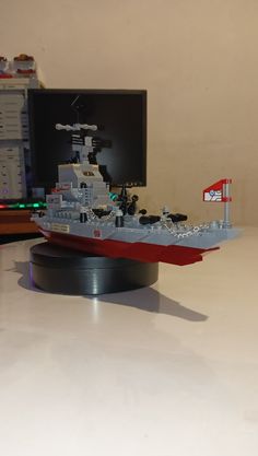 a lego model of a battleship on a table