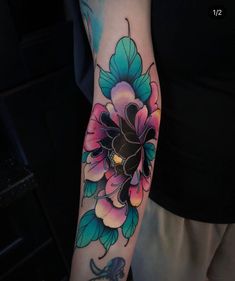 a person with a flower tattoo on their arm