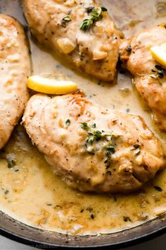 chicken with lemon sauce in a skillet ready to be served for dinner or as an appetizer