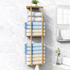 a bathroom shelf with towels on it next to a sink