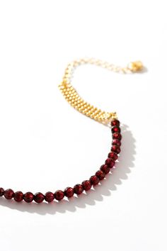 Command attention with our Ruby Woven Gold Bracelet – a statement piece that exudes luxury and sophistication. Picture yourself adorned in radiant rubies and gleaming gold, each bead a testament to your refined taste and style. With every movement, you'll captivate onlookers, leaving them breathless in awe of your undeniable presence. Elevate your ensemble and let this bracelet be the crowning jewel of your look, a symbol of your unapologetic confidence and allure. Elegant Gemstone Beads Bracelets For Party, Gold Bracelets With Polished Beads For Party, Elegant Polished Beads Bracelet For Party, Elegant Beaded Chain Bracelets For Party, Elegant Party Bracelets With Beaded Chain, Elegant Party Bracelet With Gemstone Beads, Elegant Beaded Bracelets For Party, Gold Round Beads Crystal Bracelet For Party, Gold Beaded Bracelet With Polished Beads For Parties