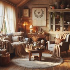 a living room filled with lots of furniture next to a wooden floor covered in blankets