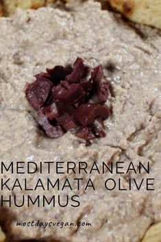 a close up of food on a plate with the words mediteranen kalaamata olive hummus