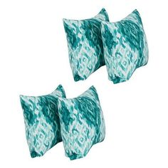 three green and white pillows sitting next to each other