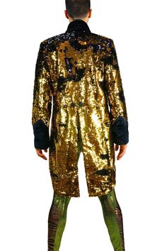 Every man needs a secret weapon in their closet. So, we made this mens black and gold sequin jacket to be the ultimate crowd pleaser. A classic silhouette with a glittery disco twist. Each of our sparkly tuxedo tailcoats is tailored to perfection and guaranteed to make you the life of the party. FEATURES: Shiny black and gold sequins that change colors when you touch them Black velvet cuffs and lapels Contrasting gold piping Blazer in front with tails in back Signature art deco satin lining Matt Gold Sequin Blazer, Sequin Tuxedo, Gold Sequin Jacket, Festival Jacket, Sequin Blazer, Mens Formal Wear, Streetwear Shop, Carbon Neutral, Sequin Jacket