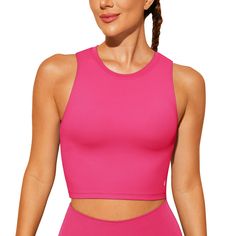 PRICES MAY VARY. Padded sports bra with removable pads for convenient adjustment. Made with high-quality nylon material with an added spandex elastic fiber which is thick but soft, sweat-wicking and not to shrink. This sleeveless crop top is pullover designed with no clasps or hooks, well constructed and seamed to be durable.High neck for added coverage. Yoga bra combine fashion, function and performance. Suitable for yoga, Pilates, fitness and any other types of exercises and workouts, or as th Pink Seamless Tank Top For Pilates, Pink Racerback Yoga Bra, Pink Racerback Crop Top For Yoga, Pink Racerback Yoga Top, Pink Bra-friendly Tank Top For Yoga, Best Sports Bras, Workout Tops For Women, Yoga Tank, Padded Sports Bra